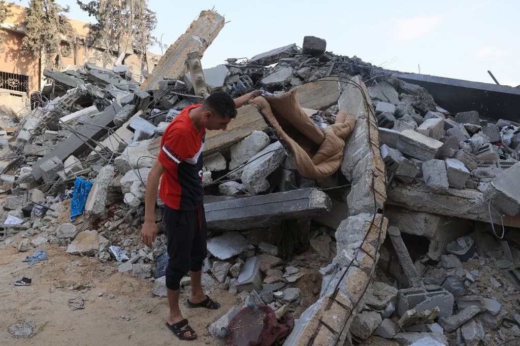 A Palestinian searches the rubble of a building following an Israeli strike, in the city Rafah, in the south of Gaza. Photo: AFP A Palestinian searches the rubble of a building following an Israeli strike, in the city Rafah, in the south of Gaza. Photo: AFP