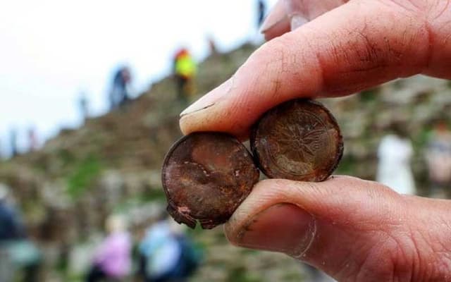 Northern Ireland’s Giant Causeway damaged by tourists wedging coins in rocks (Courtesy: File)
