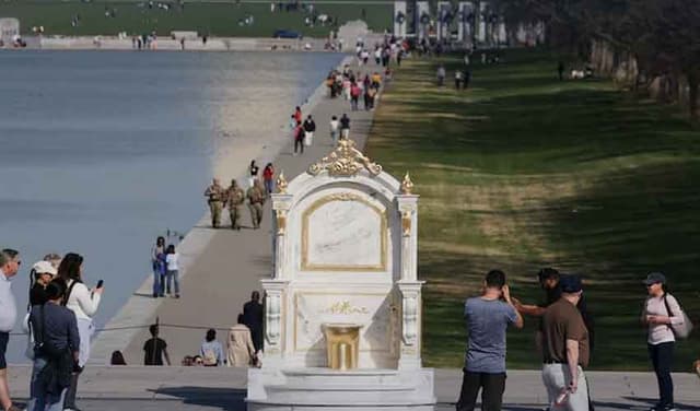 Golden toilet sculpture