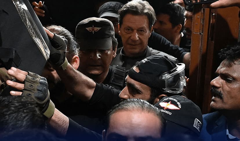 Imran Khan, Pakistan's former prime minister, leaves after appearing in court for protective bail in two charges in Lahore on March 21, 2023.