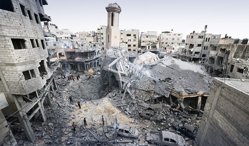 Palestinians inspect the destruction around a mosque levelled by Israeli airstrikes in Gaza City. Photo: AFP