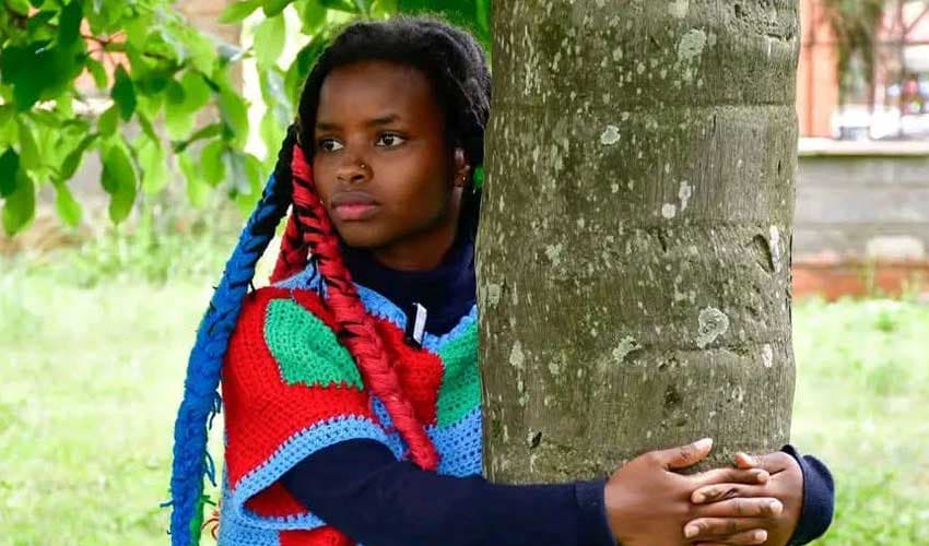 Truphena claims Guinness World Record for longest continuous tree hug (Courtesy: Online)