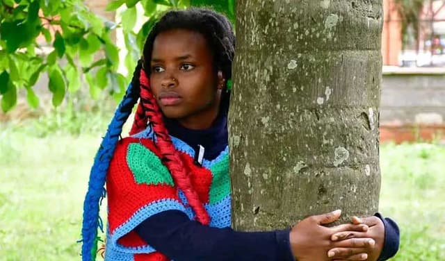 Truphena claims Guinness World Record for longest continuous tree hug (Courtesy: Online)