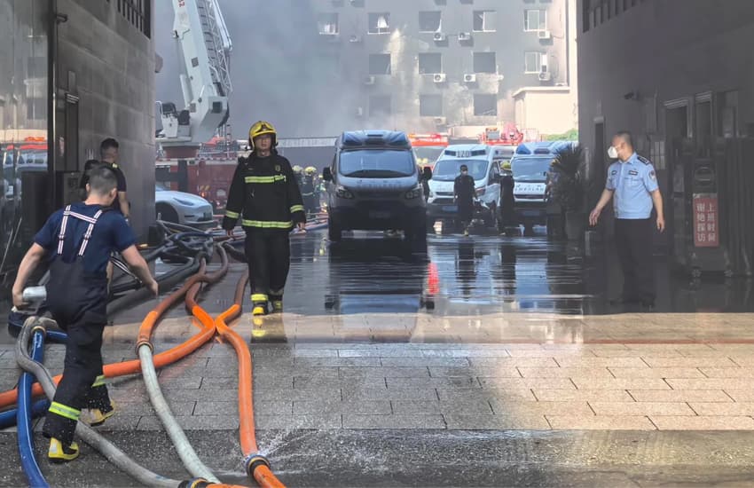 Firefighters try to extinguish flames and reach those trapped inside a shoe factory that caught fire in Jinjiang. Firefighters try to extinguish flames and reach those trapped inside a shoe factory that caught fire in Jinjiang.