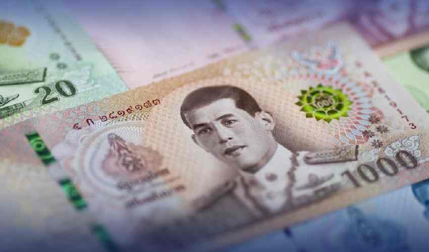 Wife of former finance minister charged in assets case