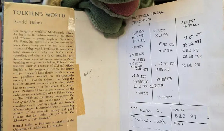 Woman returns book to library after decades